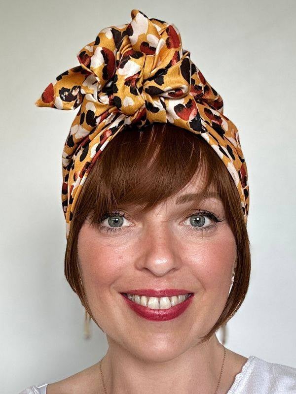 Frange Bangie en fibre synthétique — look naturel, bandeau réglable anti-glisse