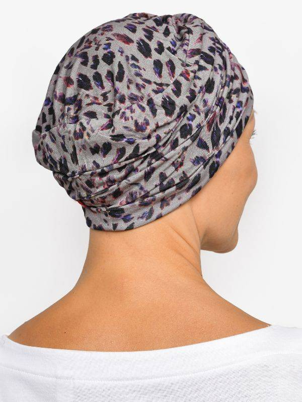 Bonnet chimio Marlene Printed Rosette La Vedette en viscose, sans couture, effet volume, doux pour cuir chevelu sensible