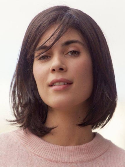 Perruque Léa mi-longue NJ Création — frange côté, bordure frontale en tulle