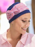 Turban Opéra NJ Création : turban léger avec grand nœud modulable pour un volume élégant, à porter sur le côté ou sur le dessus.