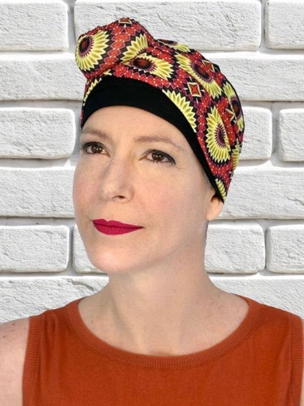 Bandeau Rosalie MM Paris en acrylique, gros nœud pour ajouter du volume et du style à un turban classique
