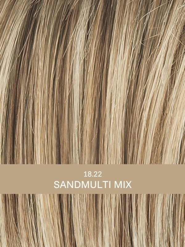 Perruque Aurora Comfort : coupe dégradée ondulée, effet rooted/mix, 100% fait main pour un confort léger et un rendu élégant.