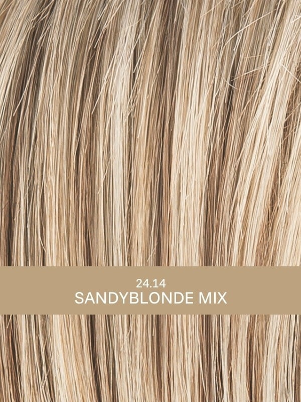 Perruque Aurora Comfort : coupe dégradée ondulée, effet rooted/mix, 100% fait main pour un confort léger et un rendu élégant.