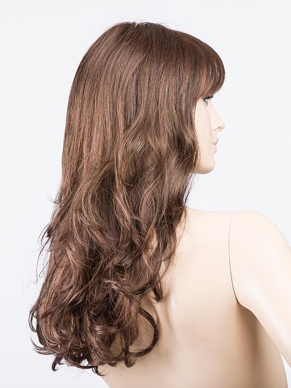 Perruque Pretty Hair Power : boucles Hollywood et frange épaisse, volume chic avec effet racines foncées ou balayage mix.